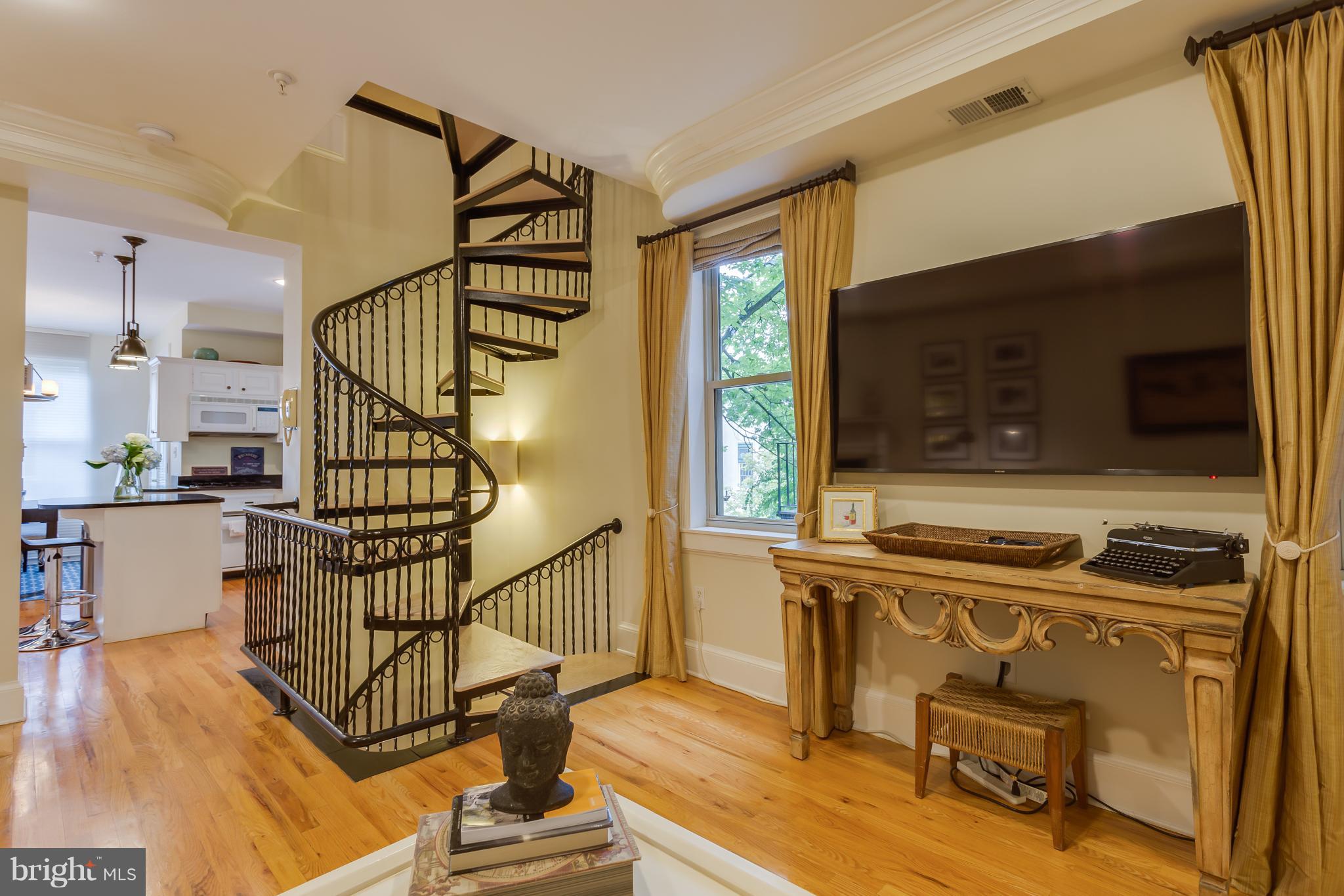 1603 16th Street Northwest, Unit 3 Washington, DC 20009 - Photo 16 of 30 a view of a livingroom with wooden floor and windows