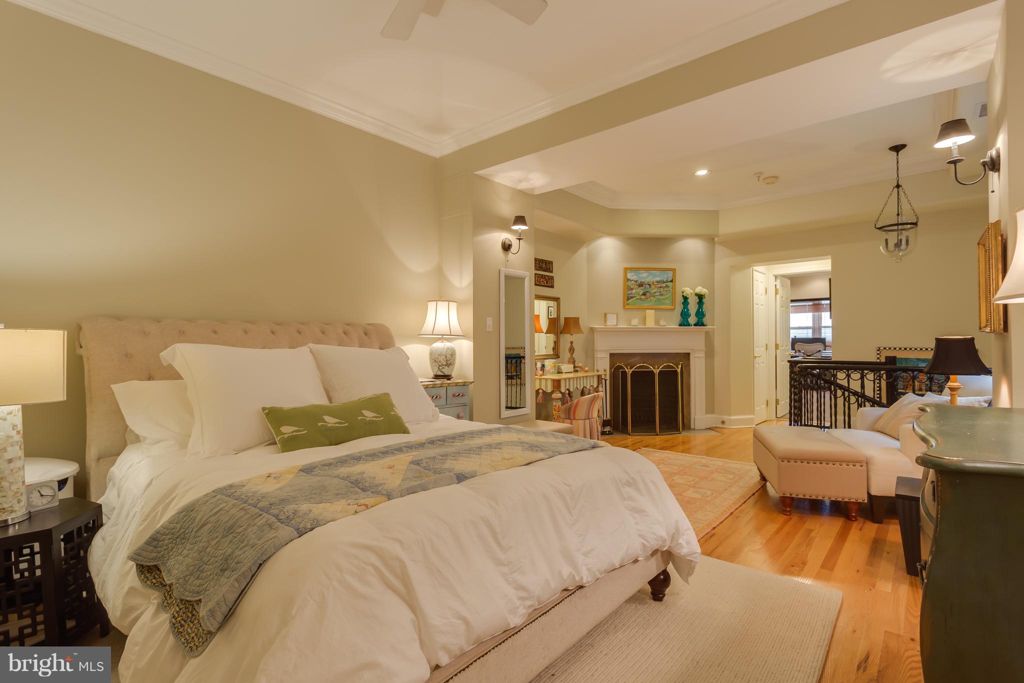 1603 16th Street Northwest, Unit 3 Washington, DC 20009 - Photo 17 of 30 a large bedroom with bed and fireplace