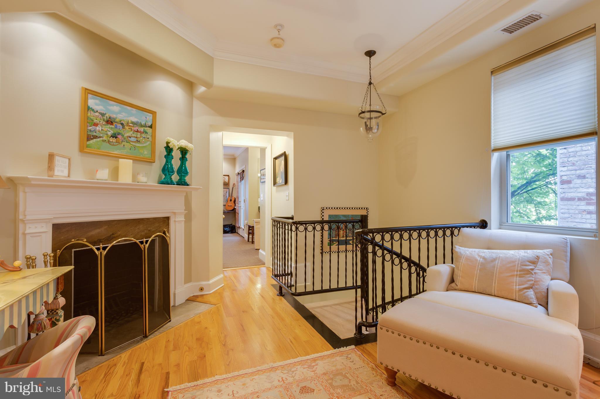 1603 16th Street Northwest, Unit 3 Washington, DC 20009 - Photo 19 of 30 a living room with furniture and a fireplace