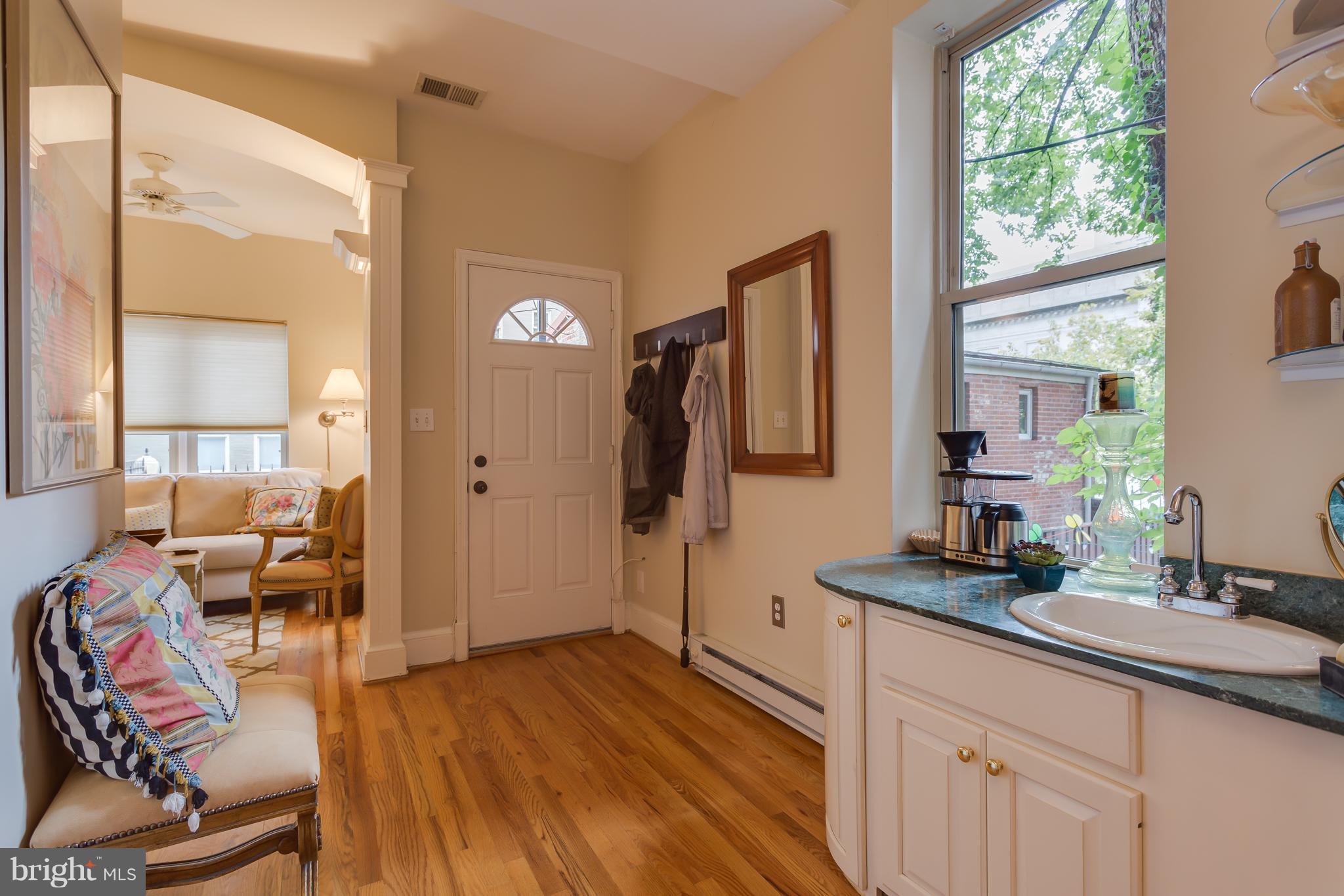 1603 16th Street Northwest, Unit 3 Washington, DC 20009 - Photo 25 of 30 a spacious bathroom with a double vanity sink and a mirror