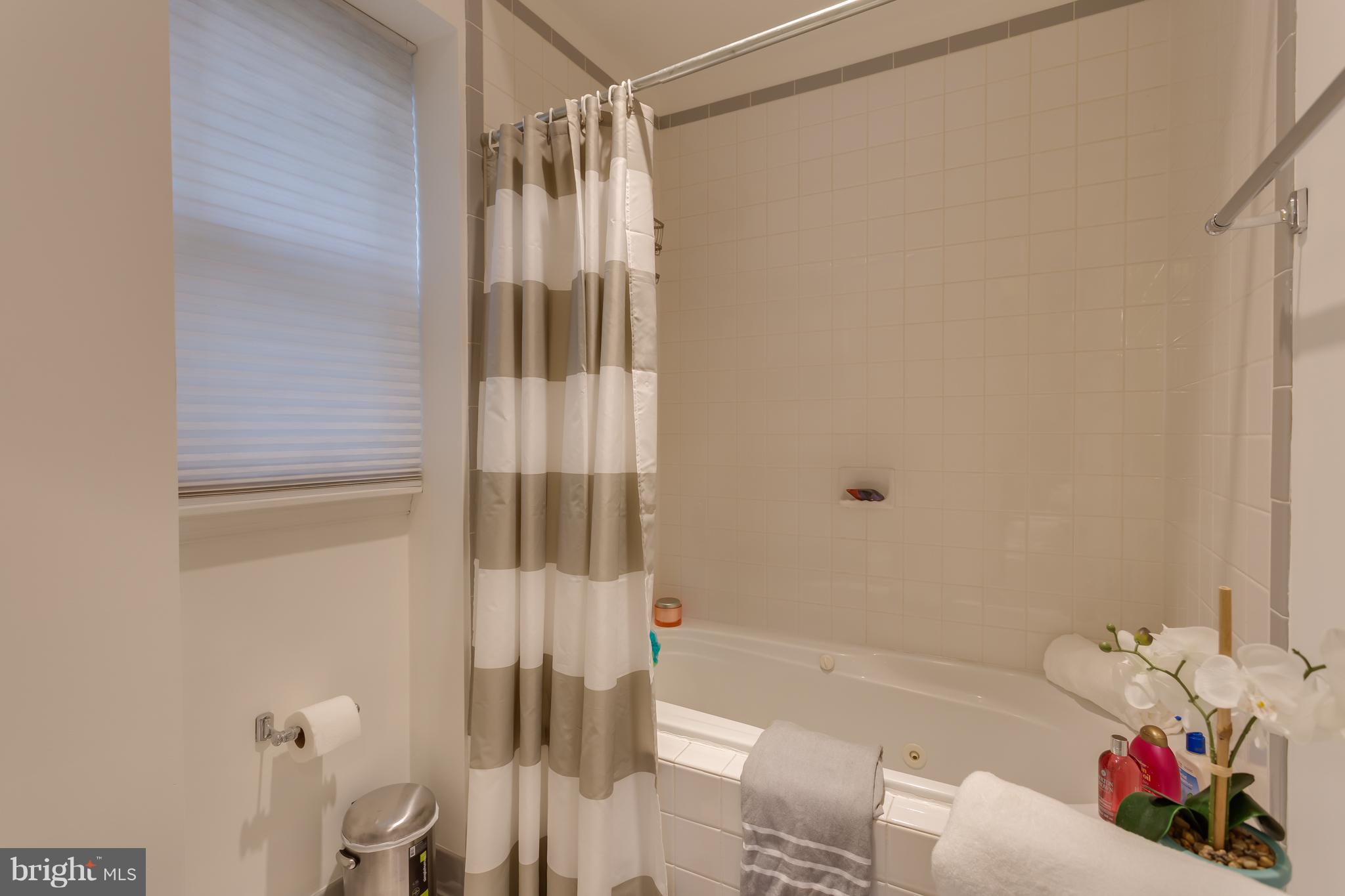 1603 16th Street Northwest, Unit 3 Washington, DC 20009 - Photo 27 of 30 a bathroom with a bathtub and shower
