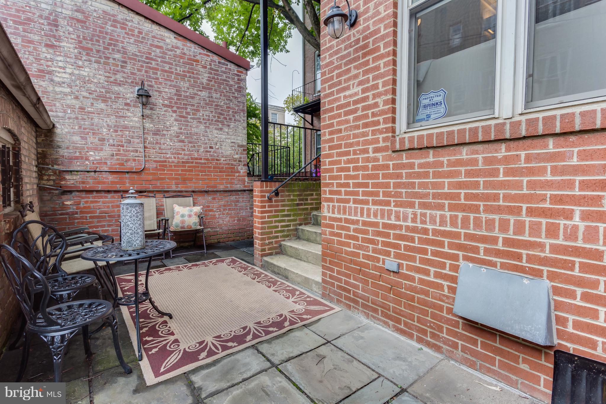 1603 16th Street Northwest, Unit 3 Washington, DC 20009 - Photo 29 of 30 a backyard of a house with seating space