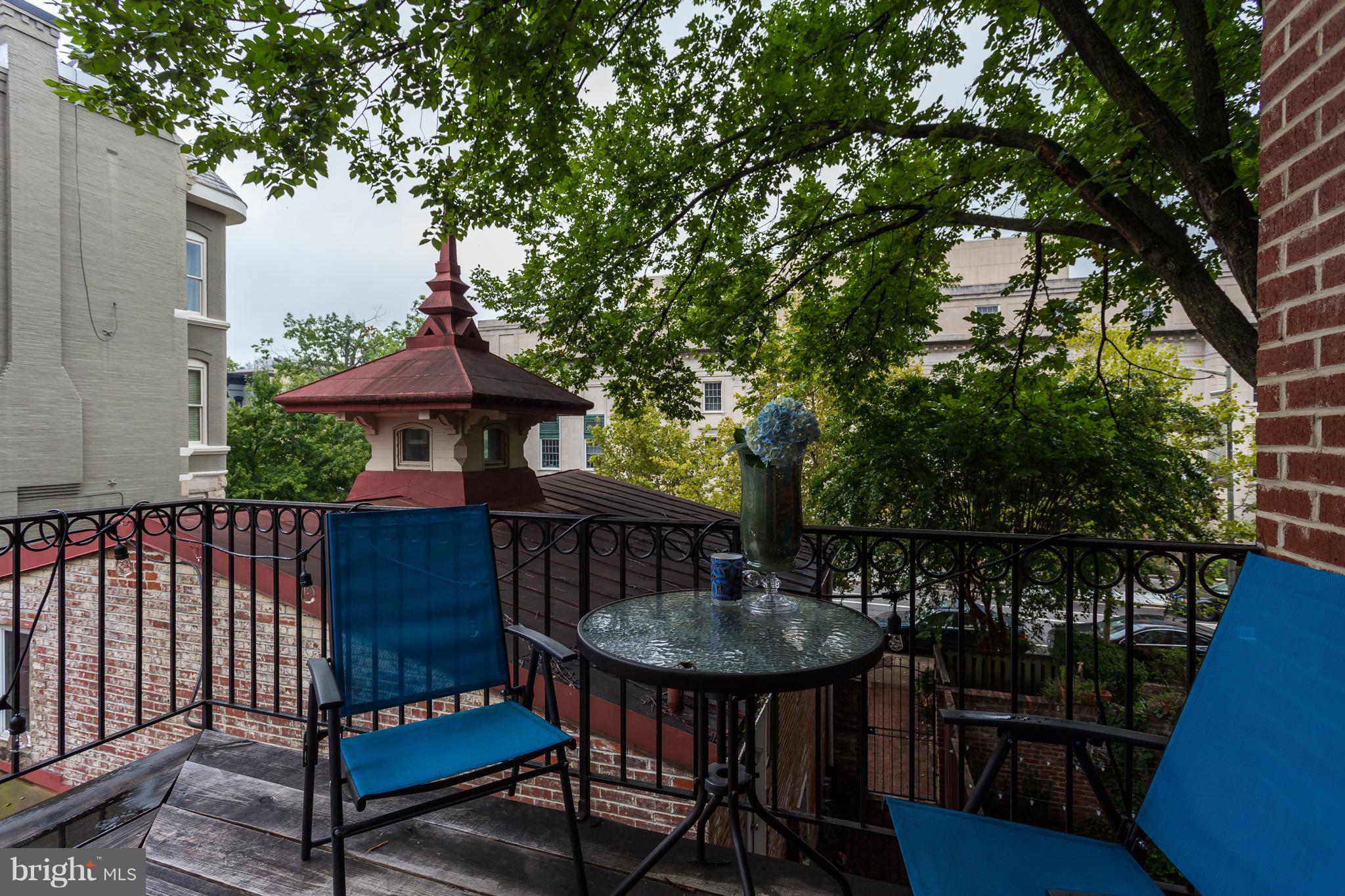 1603 16th Street Northwest, Unit 3 Washington, DC 20009 - Photo 5 of 30 a view of balcony with outdoor seating and wooden floor