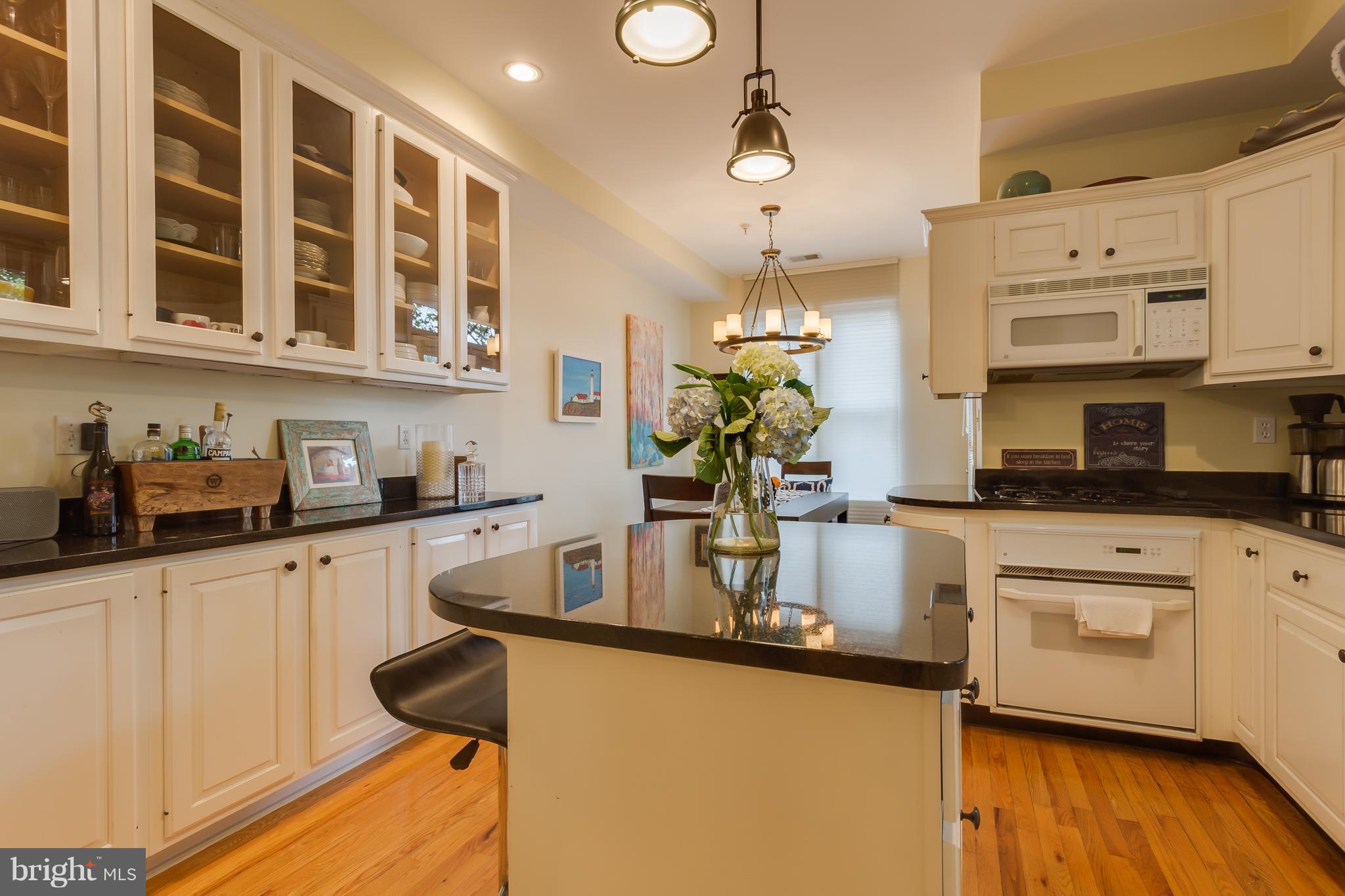 1603 16th Street Northwest, Unit 3 Washington, DC 20009 - Photo 7 of 30 a kitchen with stainless steel appliances granite countertop a sink and cabinets