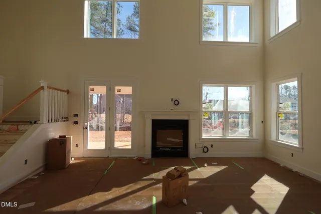 a bedroom with furniture and a fireplace