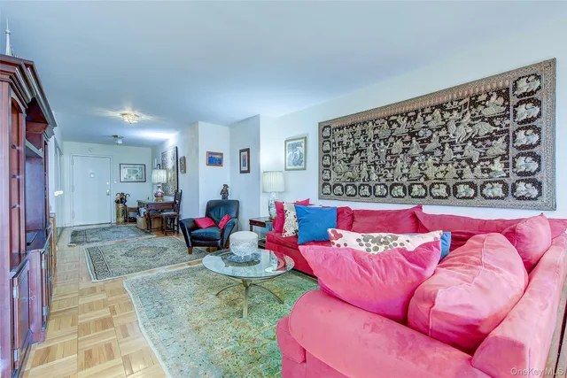a view of a dining room with furniture and chandelier