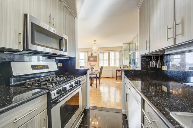 a bedroom with bed and a book shelf