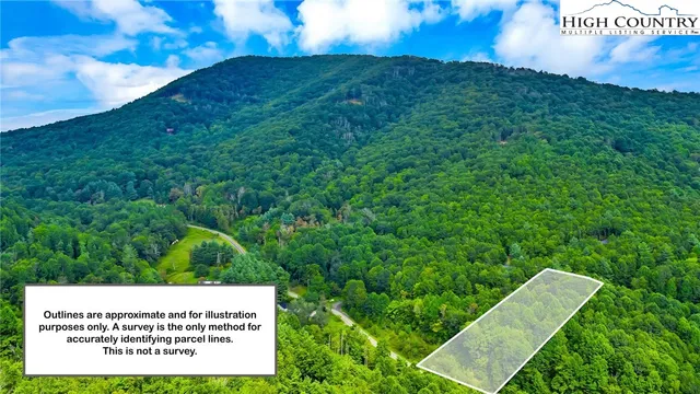 a view of a street with a yard