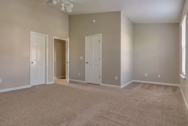 an empty room with closet area