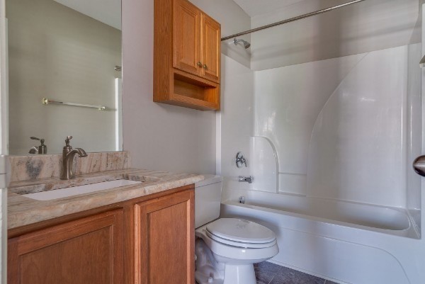 1990 Shaylin Loop Antioch, TN 37013 - Photo 16 of 20 a bathroom with a granite countertop sink toilet and shower