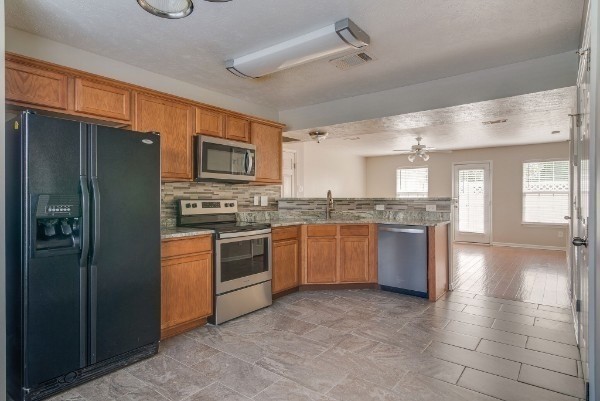 1990 Shaylin Loop Antioch, TN 37013 - Photo 8 of 20 a large kitchen with granite countertop a large counter top stainless steel appliances and cabinets