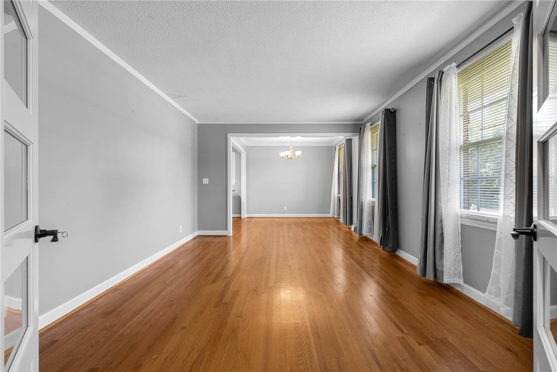 300 Green Street Williamston, SC 29697 - Photo 7 of 47 Rich hardwood floors flow through this luminous interior with abundant natural light.