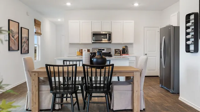 a kitchen with stainless steel appliances a sink stove and refrigerator