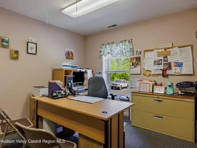 a view of a workspace with furniture