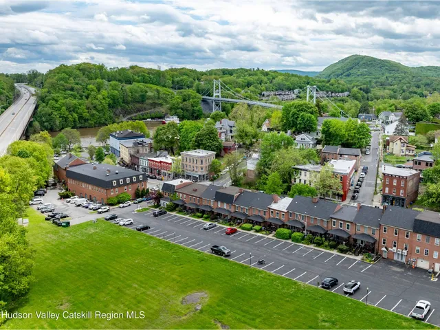 a view of backyard with seating area and green space