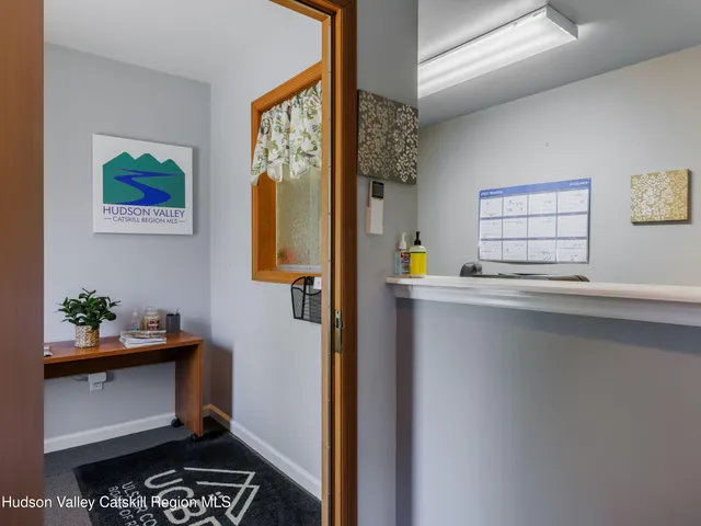 a kitchen with a refrigerator and window