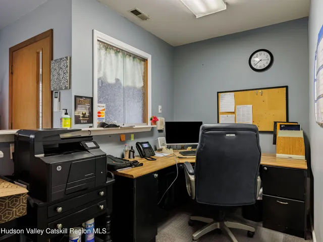 a room with a window and a chair