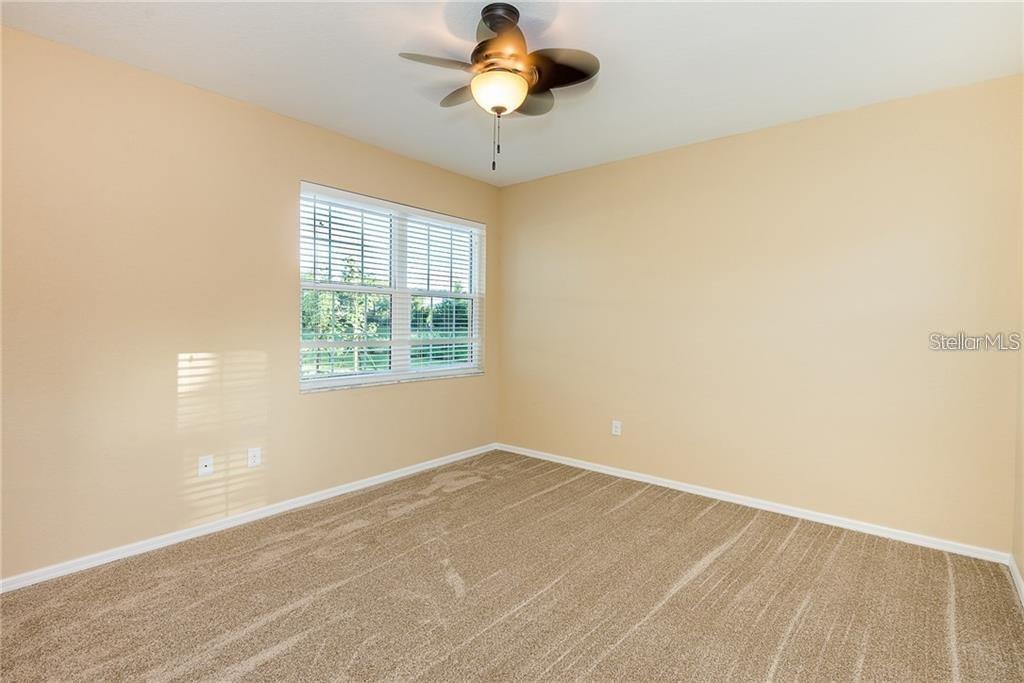 3948 San Rocco Drive, Unit 112 Punta Gorda, FL 33950 - Photo 14 of 18 a view of a room with a window and a ceiling fan