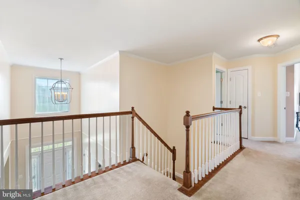 a view of a hallway with a window