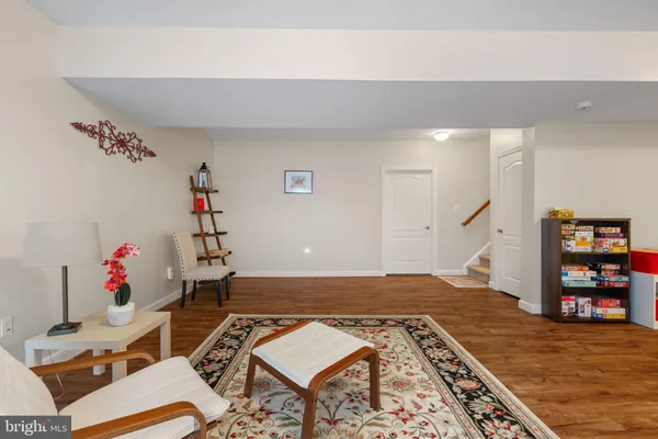 a bedroom with furniture and a book shelf