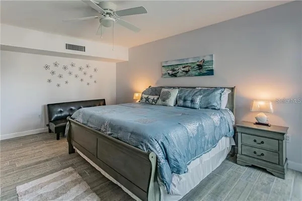 a bedroom with a bed and a dresser