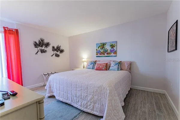 a bedroom with a bed and a desk