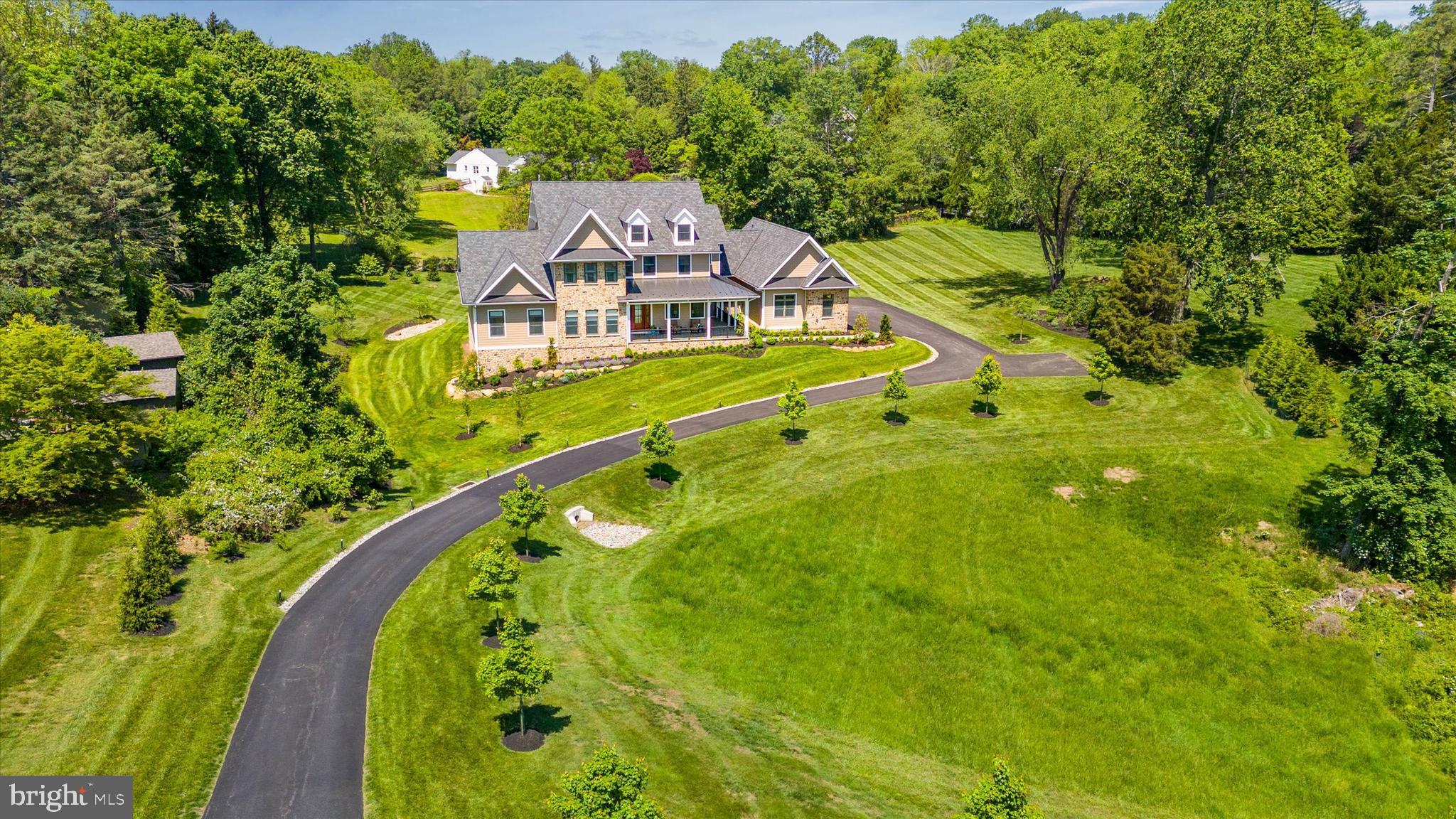 a aerial view of a house with a big yard