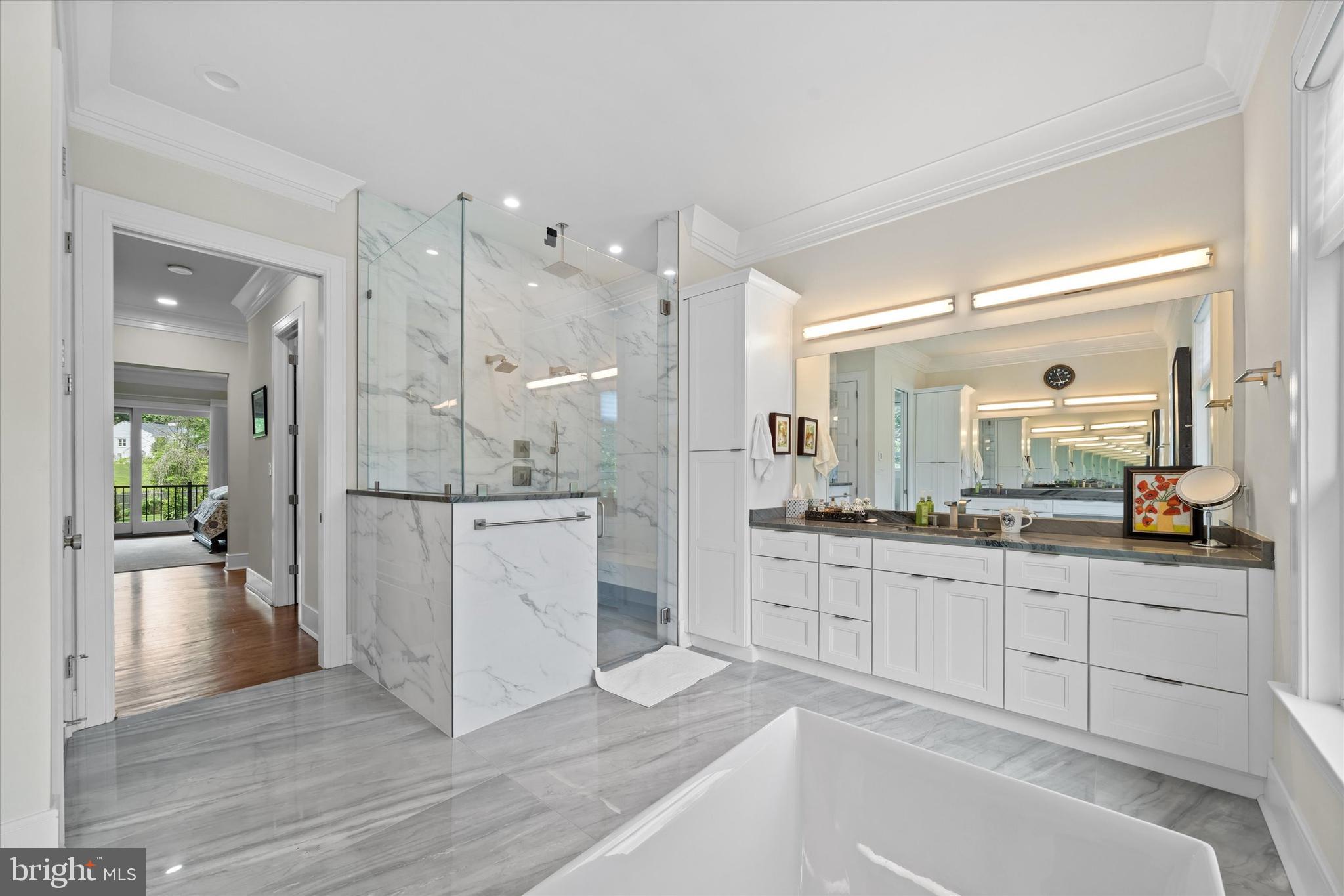 5 Raintree Road Chadds Ford, PA 19317 - Photo 11 of 58 a large white kitchen with a large window a sink and stainless steel appliances