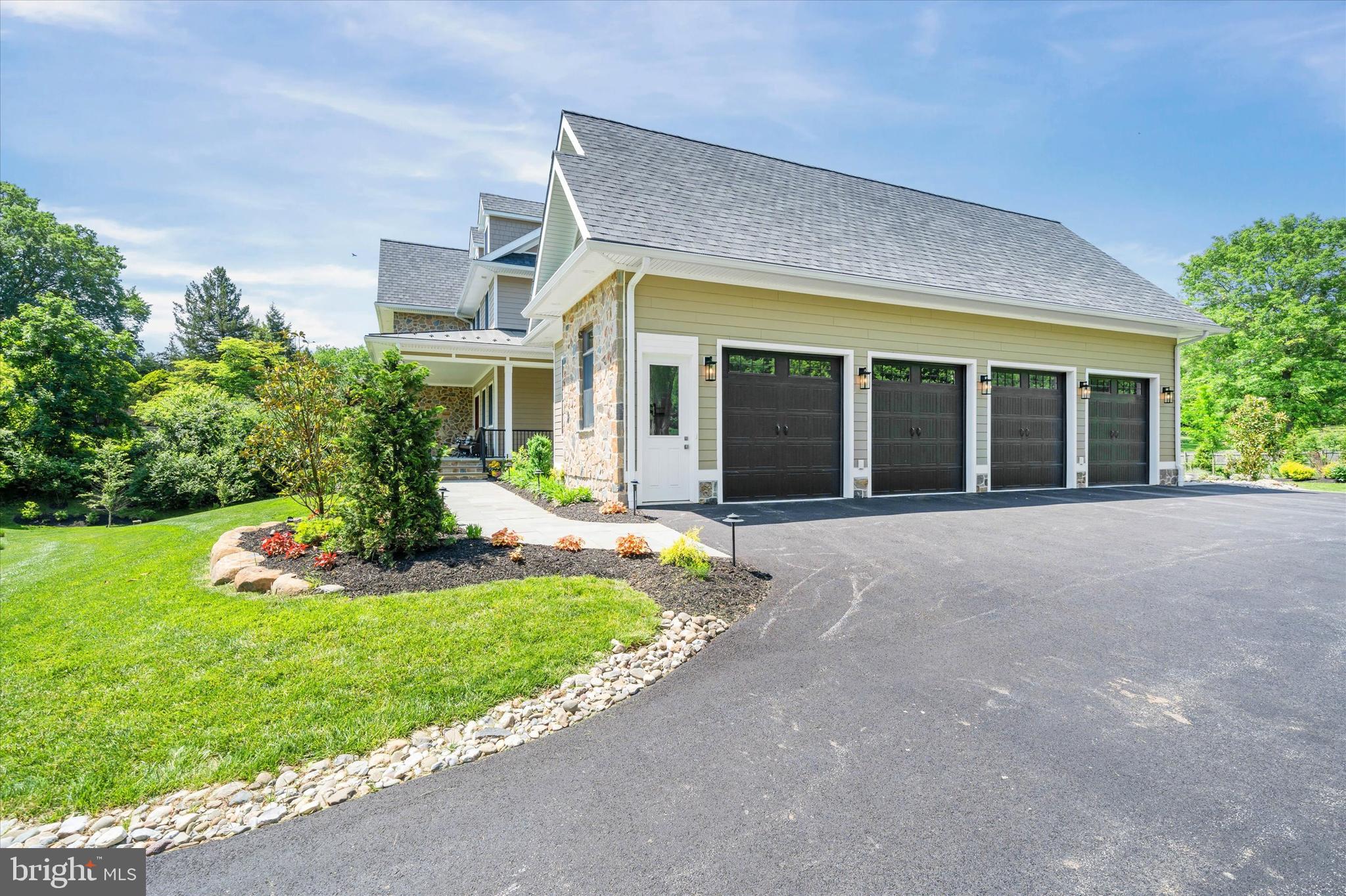 5 Raintree Road Chadds Ford, PA 19317 - Photo 14 of 58 a view of a house with yard and garden