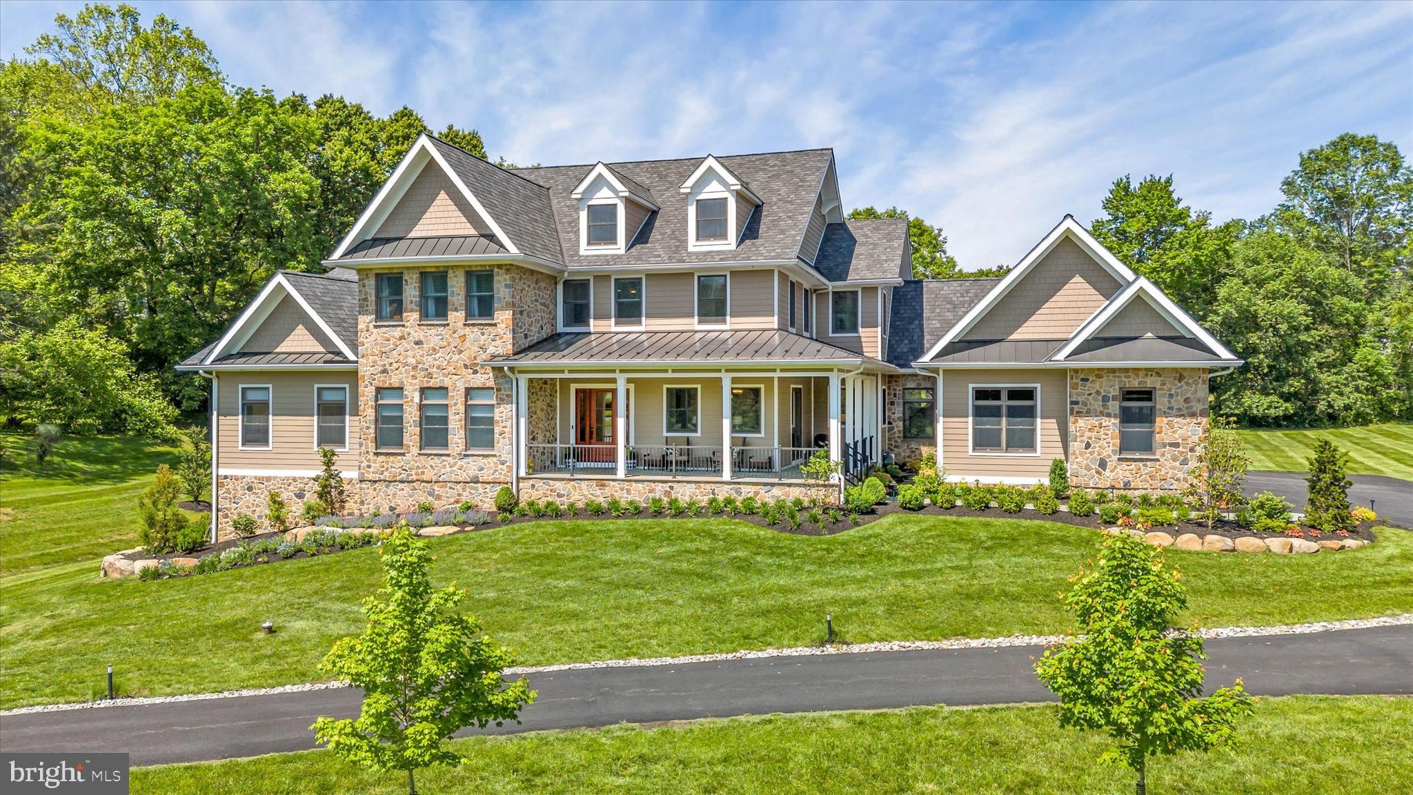 5 Raintree Road Chadds Ford, PA 19317 - Photo 2 of 58 a front view of a house with a yard