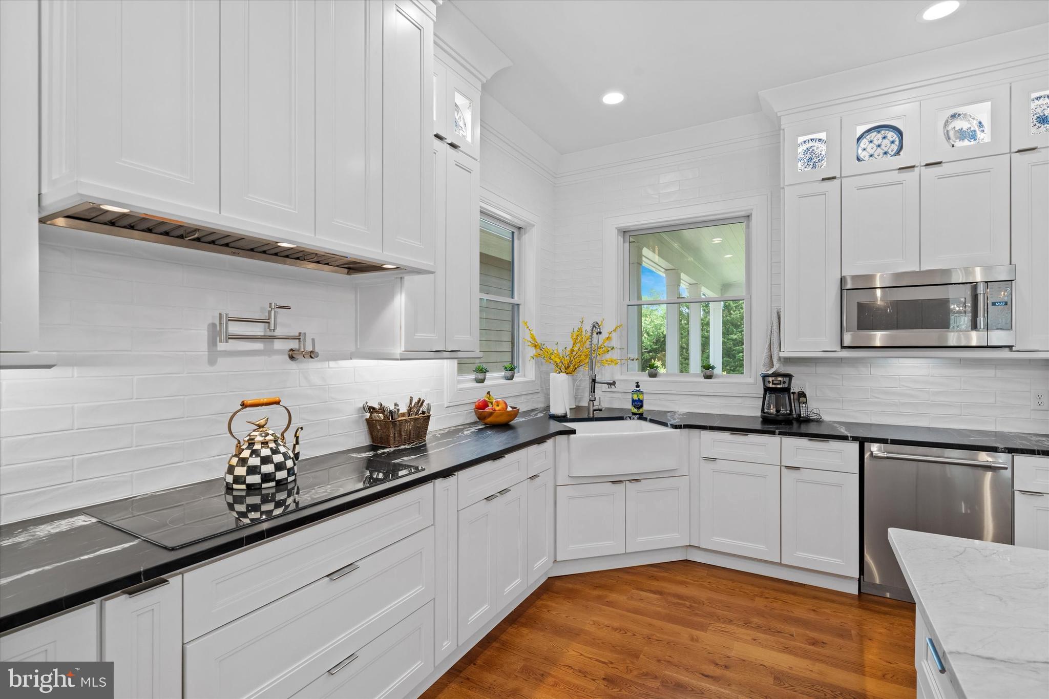 5 Raintree Road Chadds Ford, PA 19317 - Photo 27 of 58 a kitchen with stainless steel appliances granite countertop a sink a stove and cabinets