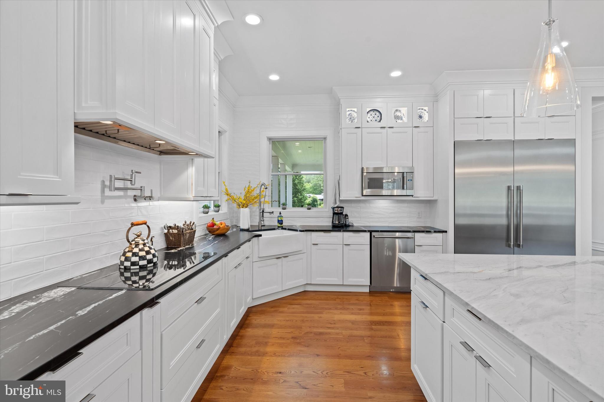5 Raintree Road Chadds Ford, PA 19317 - Photo 28 of 58 a large kitchen with stainless steel appliances lots of counter space and a sink