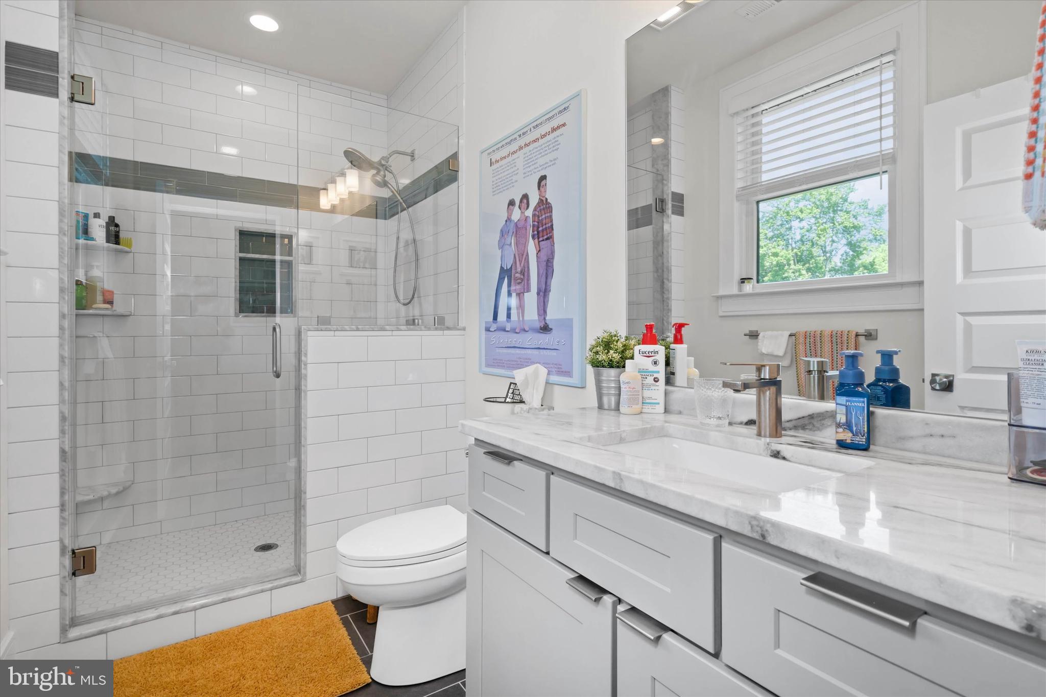 5 Raintree Road Chadds Ford, PA 19317 - Photo 29 of 58 a bathroom with a granite countertop sink a toilet and shower