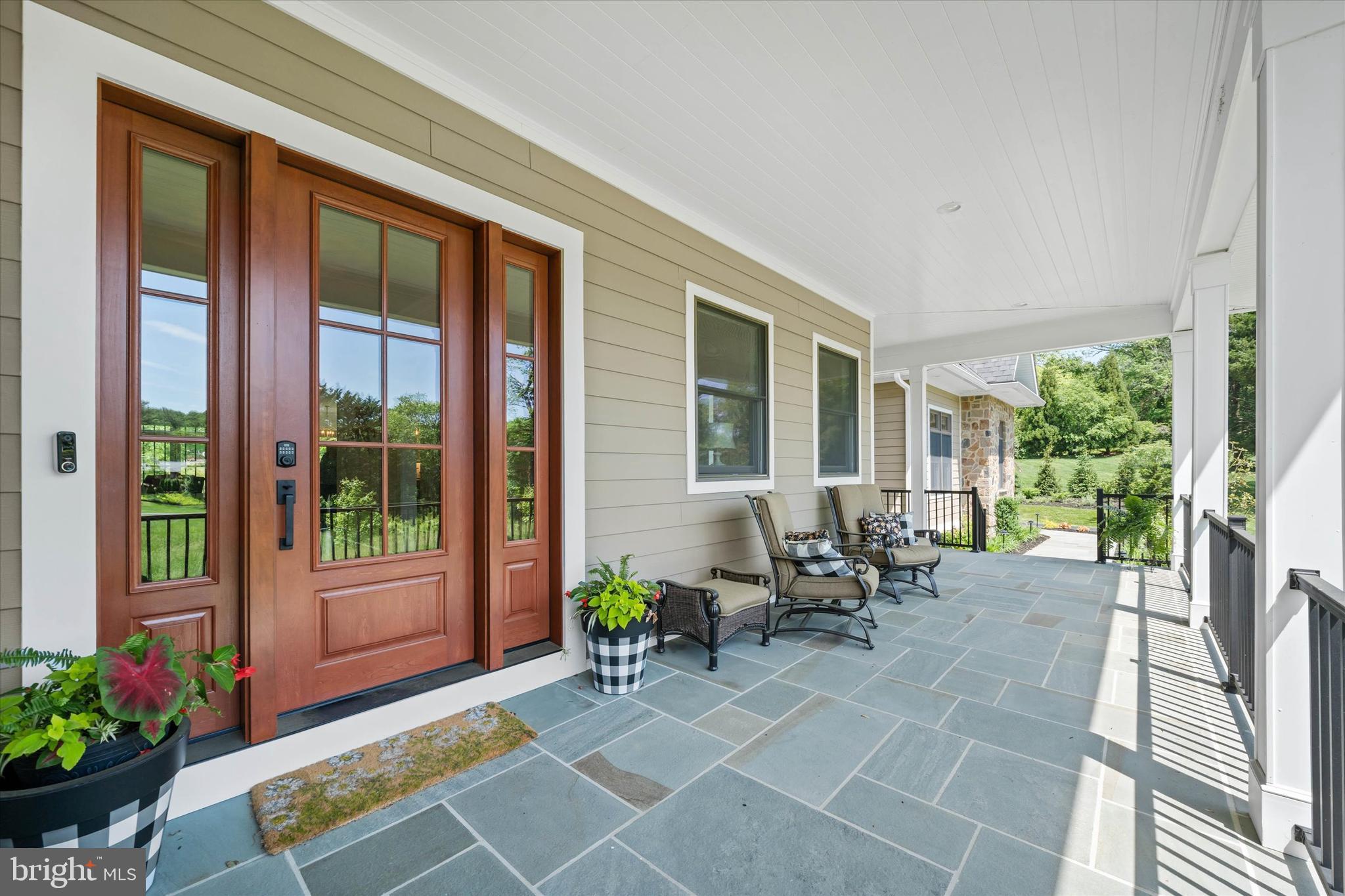 5 Raintree Road Chadds Ford, PA 19317 - Photo 3 of 58 a living room filled with furniture and a potted plant