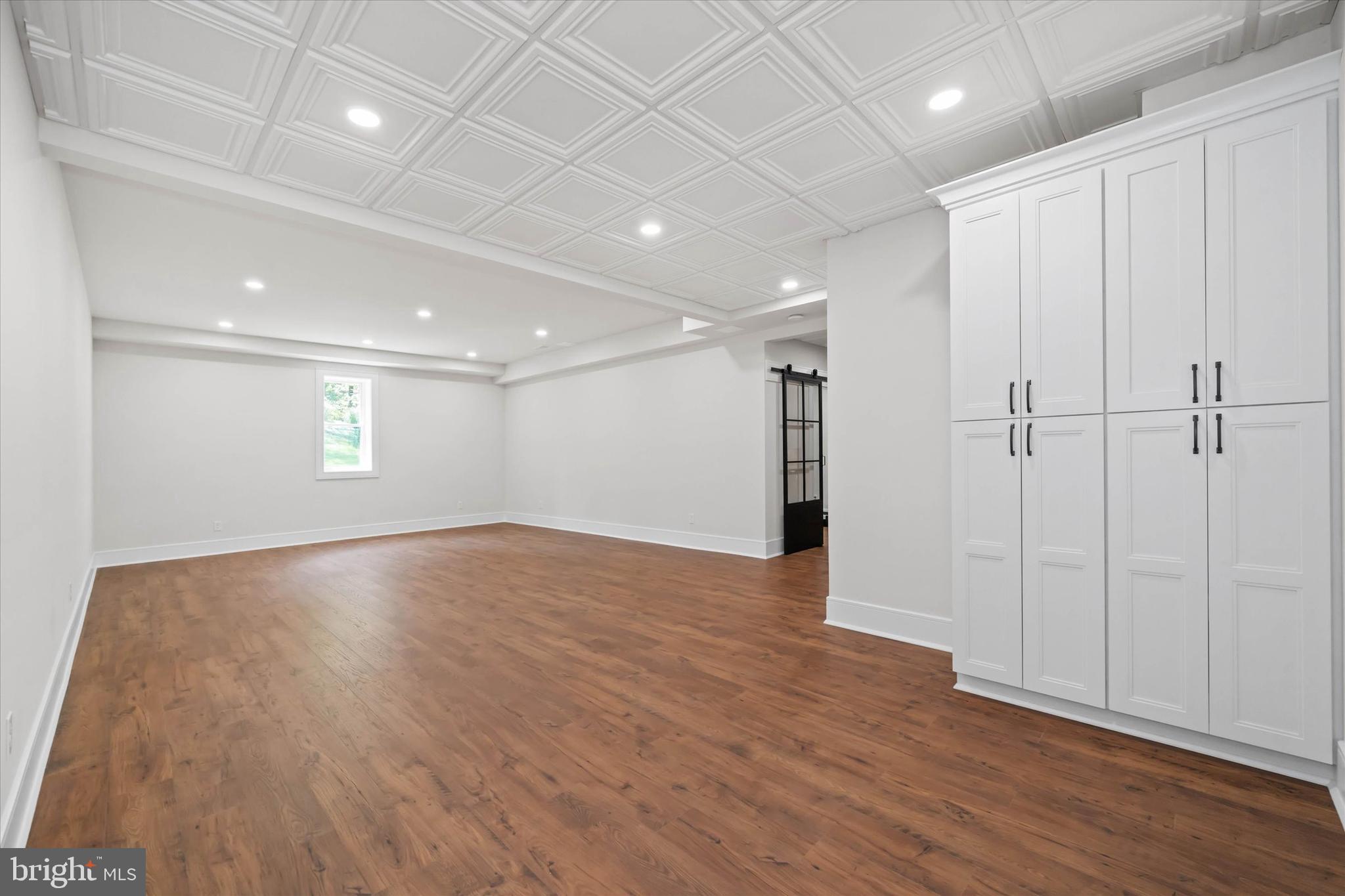 5 Raintree Road Chadds Ford, PA 19317 - Photo 32 of 58 an empty room with wooden floor