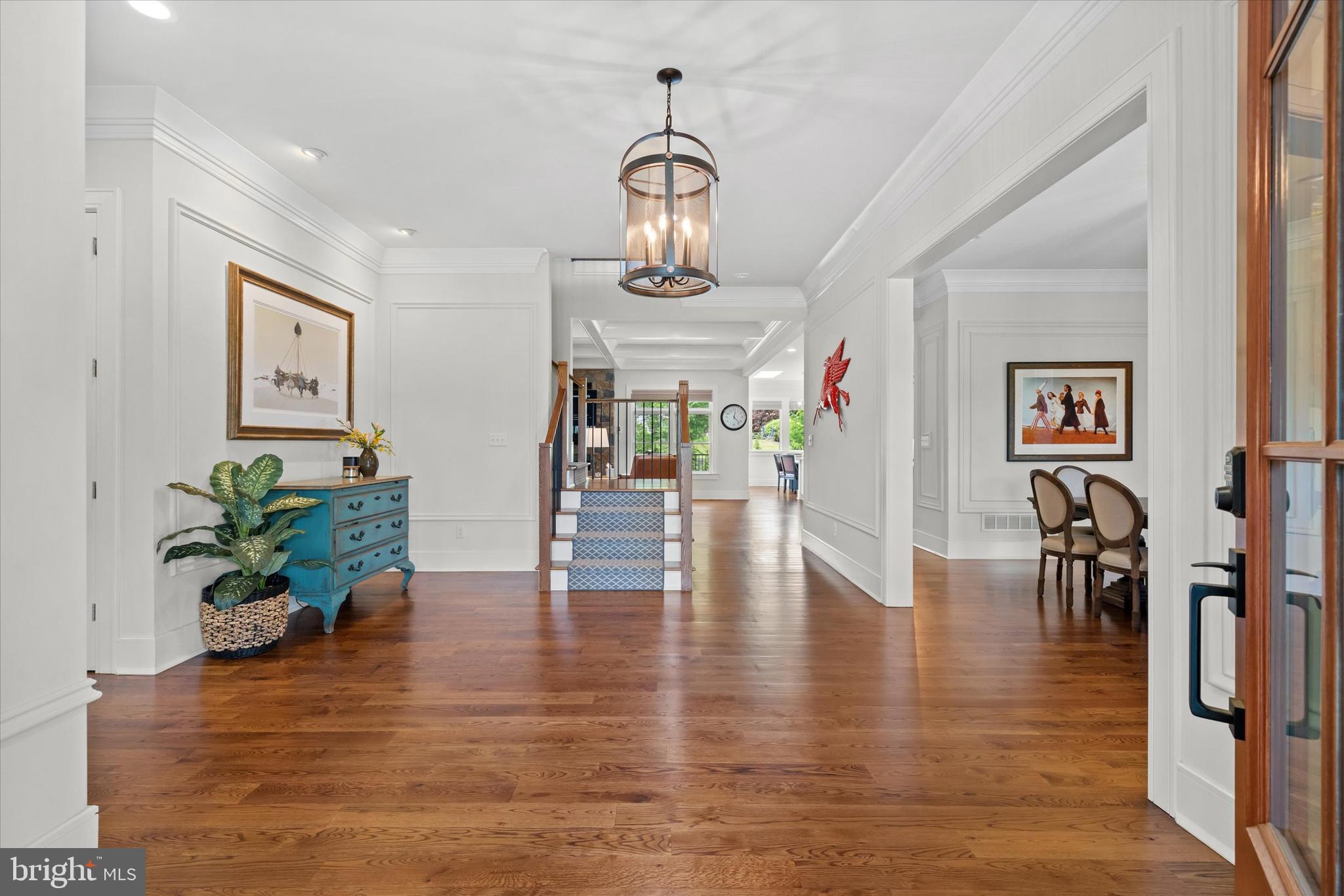 5 Raintree Road Chadds Ford, PA 19317 - Photo 4 of 58 a view of a dining room with furniture wooden floor and a chandelier