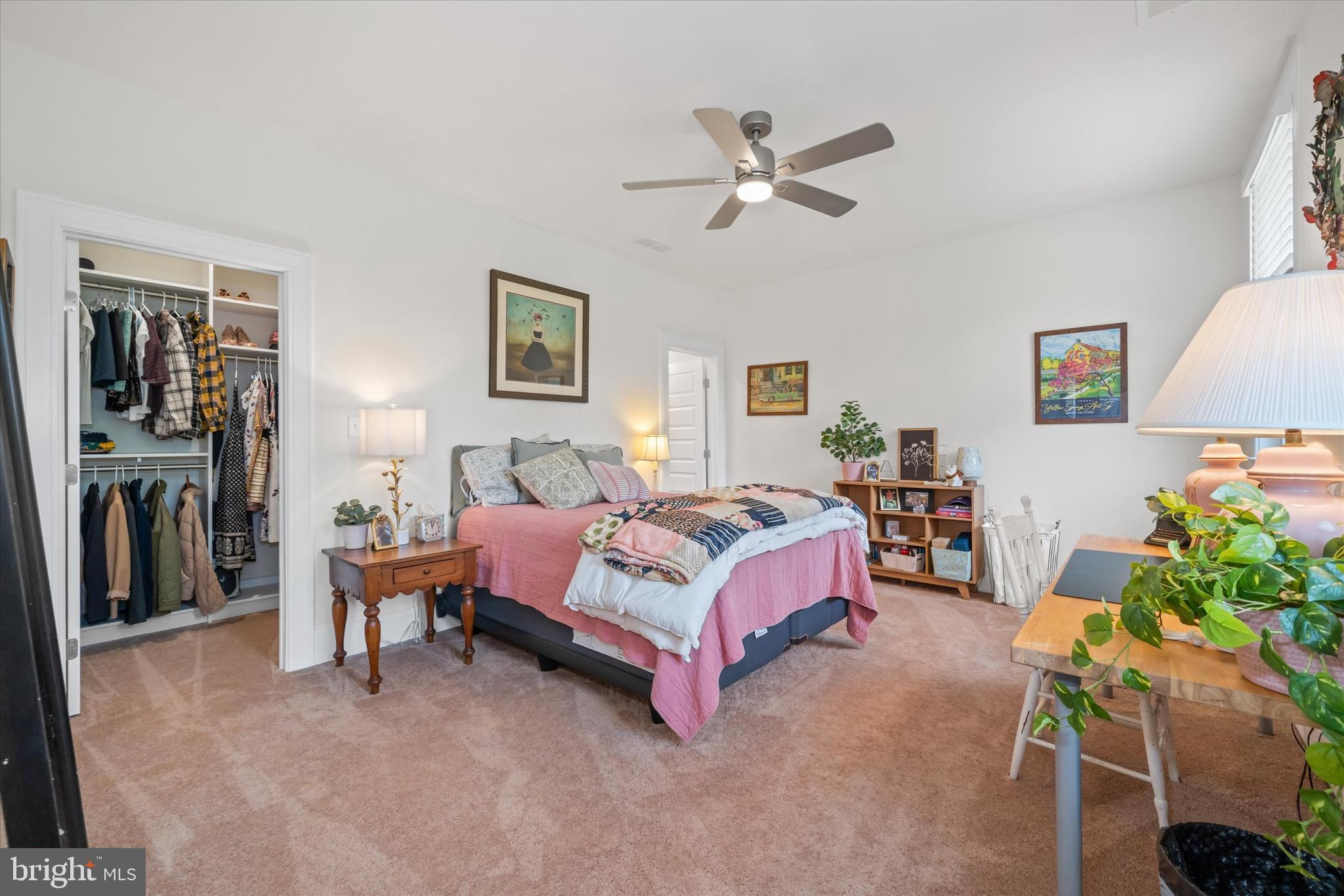 5 Raintree Road Chadds Ford, PA 19317 - Photo 43 of 58 a spacious bedroom with a bed and a chandelier