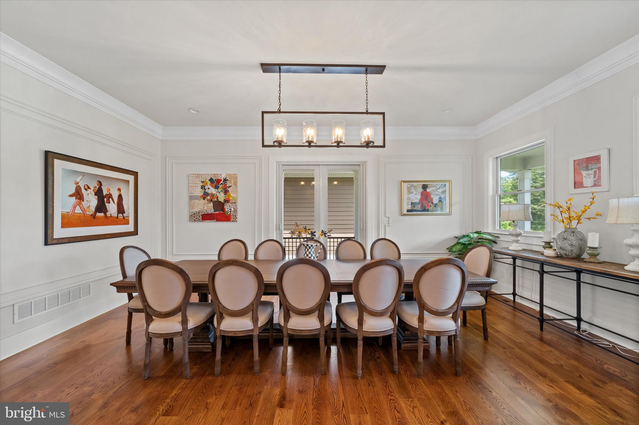 5 Raintree Road Chadds Ford, PA 19317 - Photo 5 of 58 a view of a dining room with furniture wooden floor and chandelier
