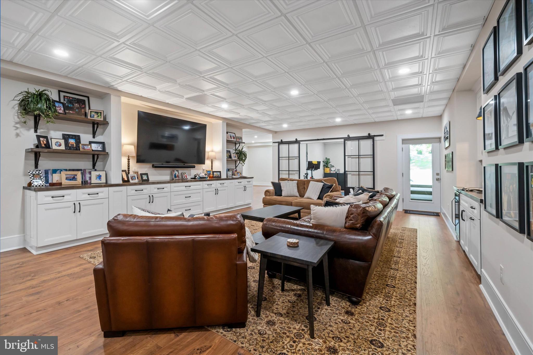 5 Raintree Road Chadds Ford, PA 19317 - Photo 51 of 58 a living room with furniture and a flat screen tv