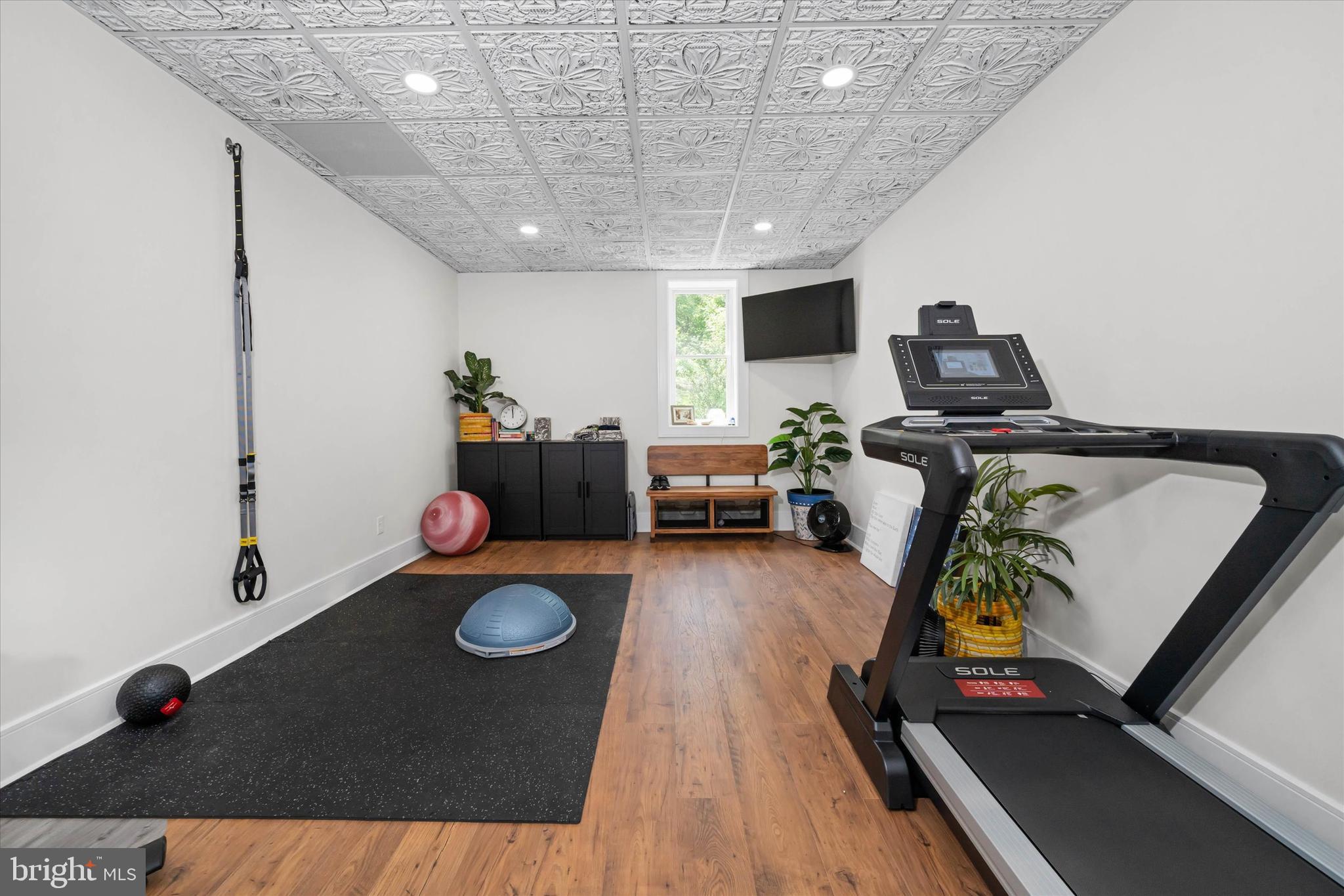 5 Raintree Road Chadds Ford, PA 19317 - Photo 53 of 58 a living room with furniture and a flat screen tv