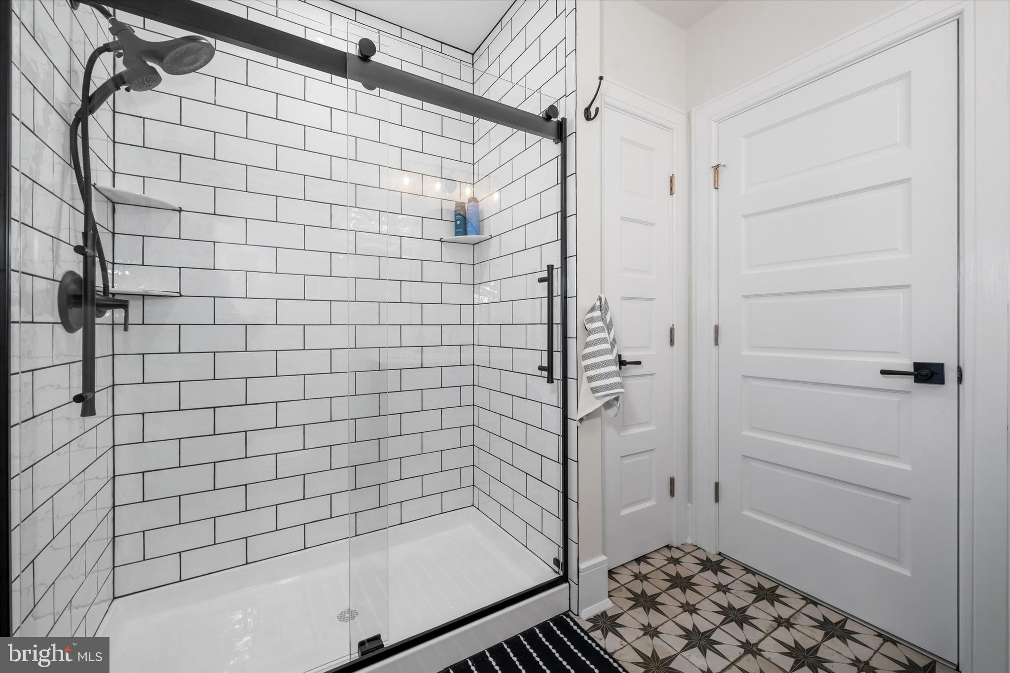 5 Raintree Road Chadds Ford, PA 19317 - Photo 55 of 58 a bathroom with a bathtub and shower