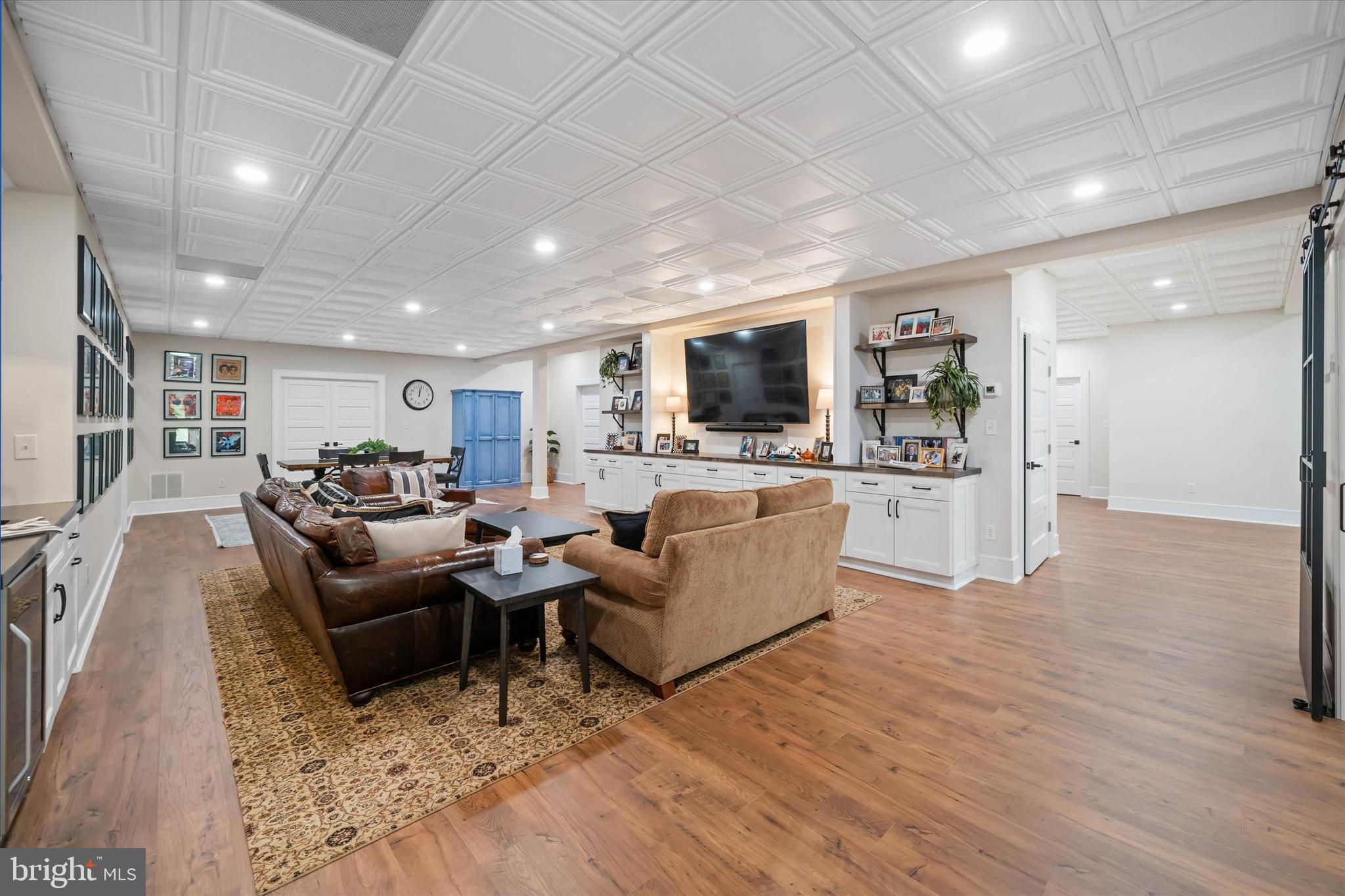 5 Raintree Road Chadds Ford, PA 19317 - Photo 56 of 58 a living room with furniture and a flat screen tv