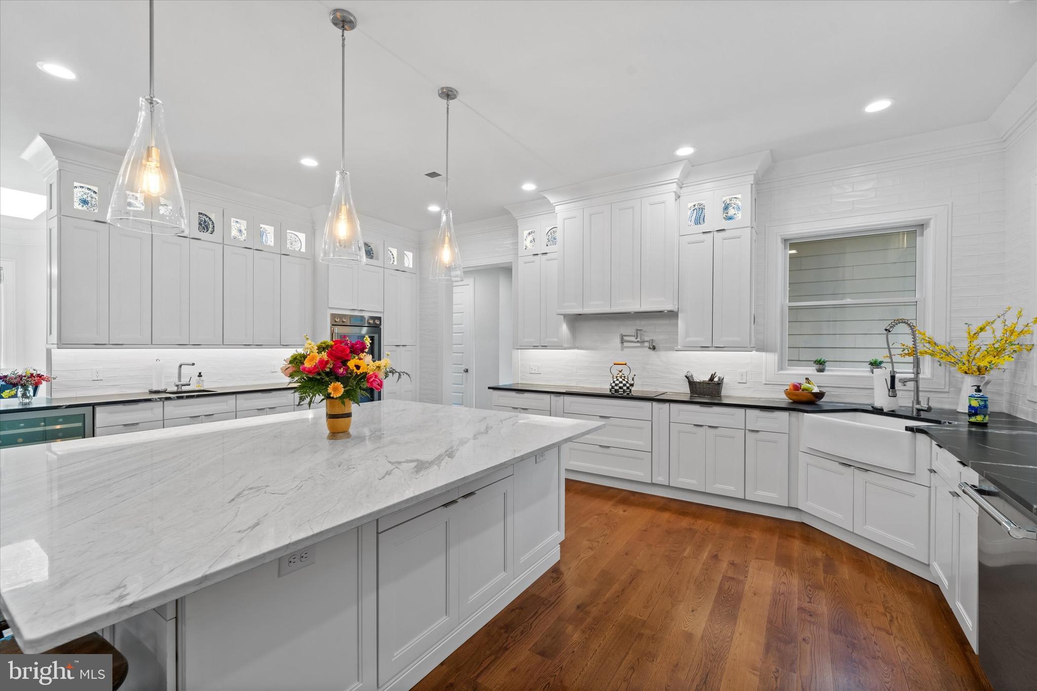 5 Raintree Road Chadds Ford, PA 19317 - Photo 6 of 58 a kitchen with kitchen island granite countertop a sink appliances and cabinets
