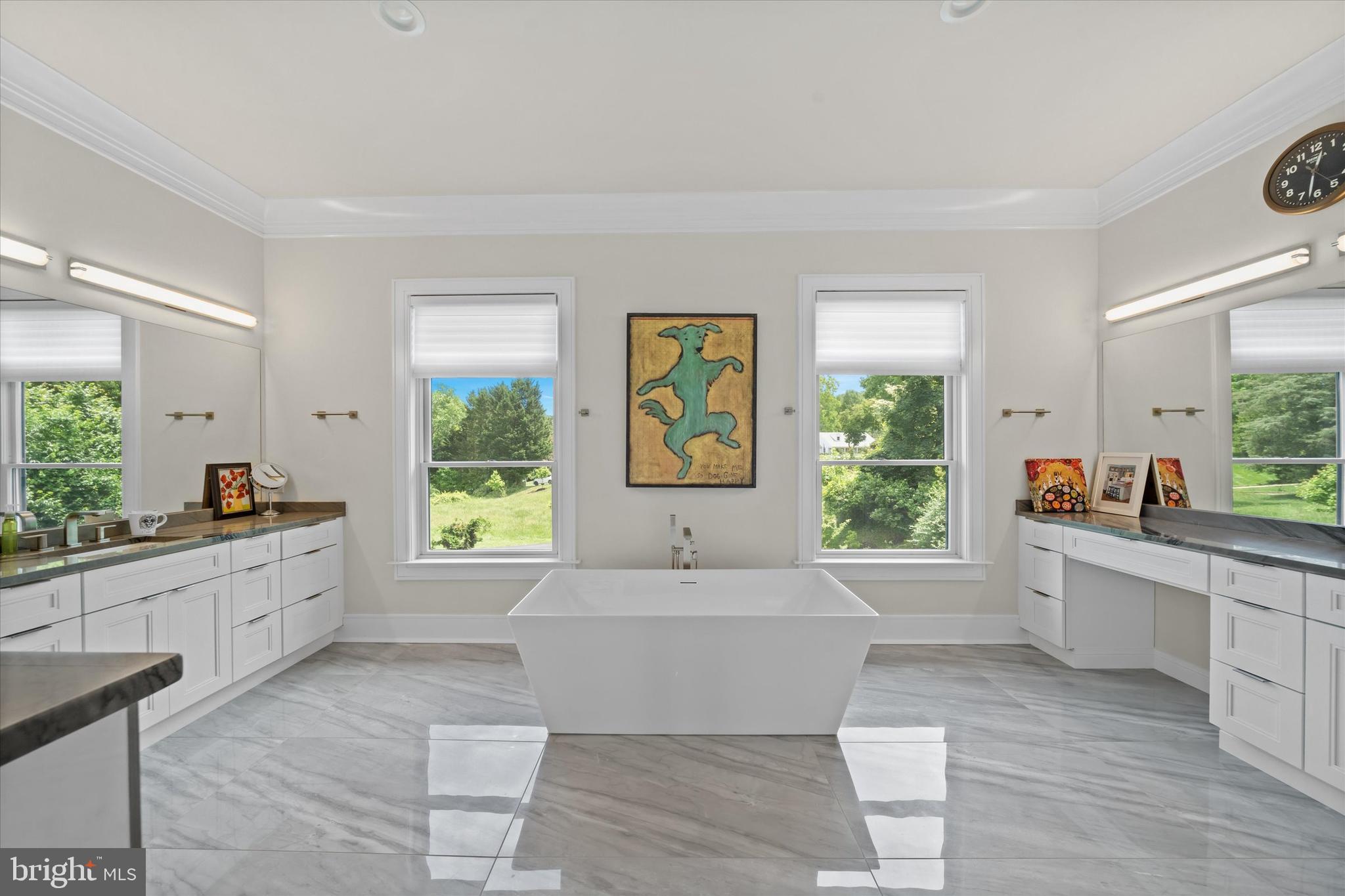 5 Raintree Road Chadds Ford, PA 19317 - Photo 10 of 58 a large living room with a large window couches and kitchen view