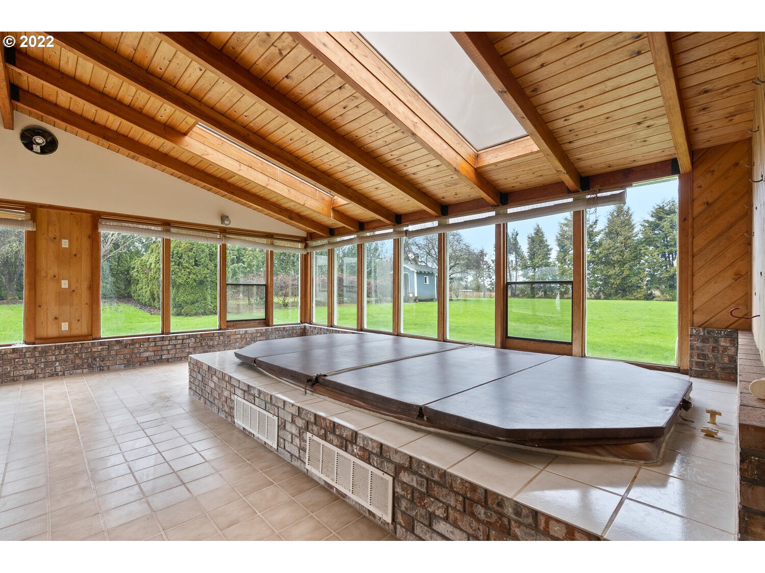 21114 Northwest 43rd Avenue Ridgefield, WA 98642 - Photo 16 of 32 a swimming pool with outdoor seating and outdoor shower