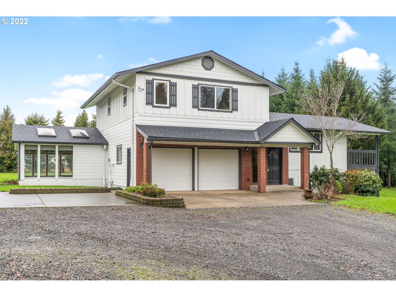 21114 Northwest 43rd Avenue Ridgefield, WA 98642 - Photo 3 of 32 a front view of a house with a yard