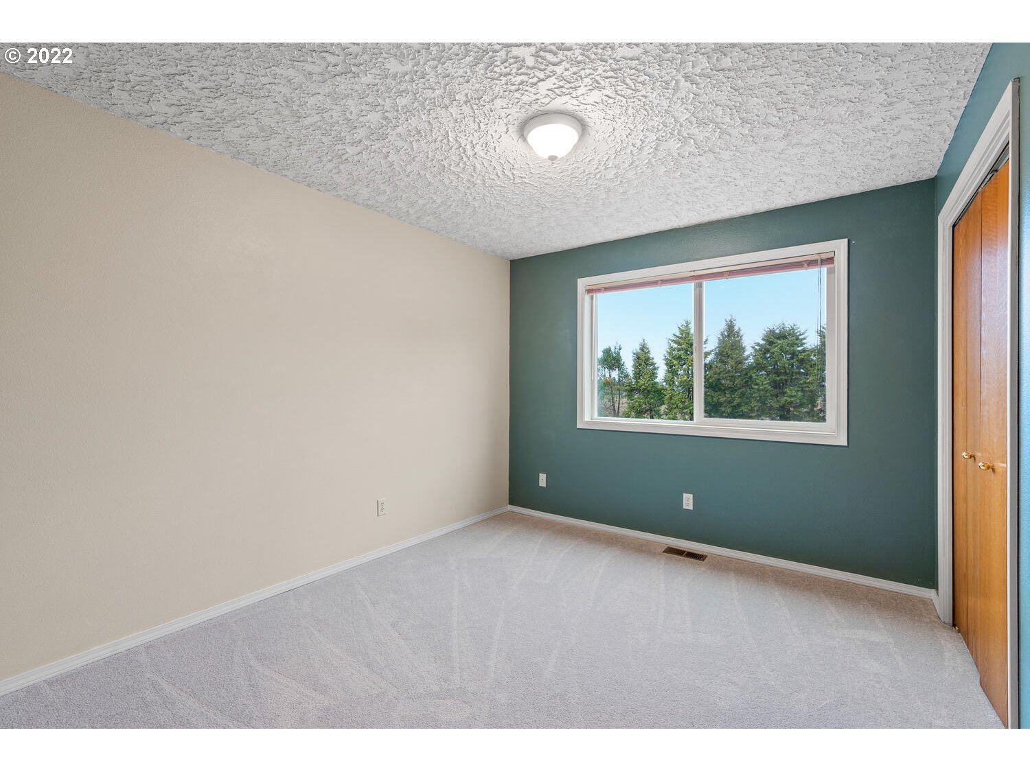 21114 Northwest 43rd Avenue Ridgefield, WA 98642 - Photo 24 of 32 a view of an empty room with a window