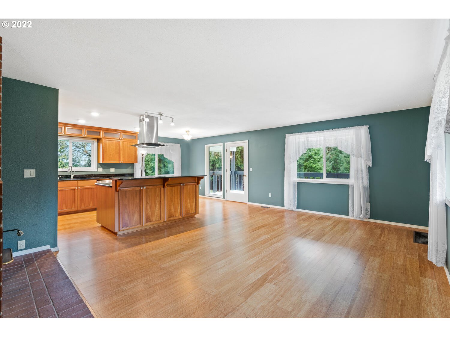 21114 Northwest 43rd Avenue Ridgefield, WA 98642 - Photo 6 of 32 a view of kitchen and empty room with large window