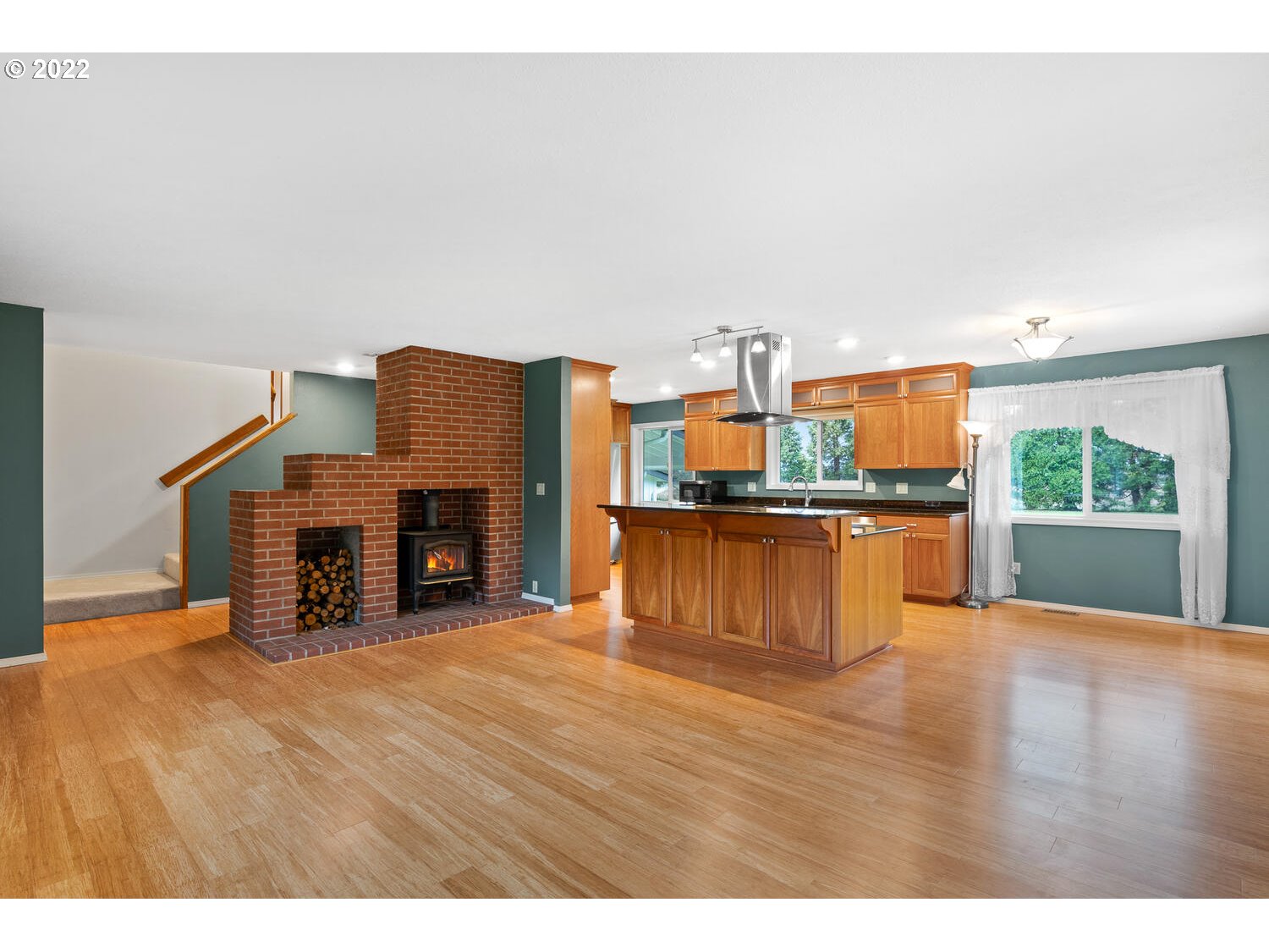 21114 Northwest 43rd Avenue Ridgefield, WA 98642 - Photo 7 of 32 a view of kitchen with furniture and a fireplace