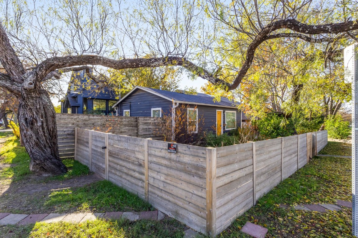 713 East 45th Street Austin, TX 78751 - Photo 1 of 28 a front view of house with yard and trees in the background